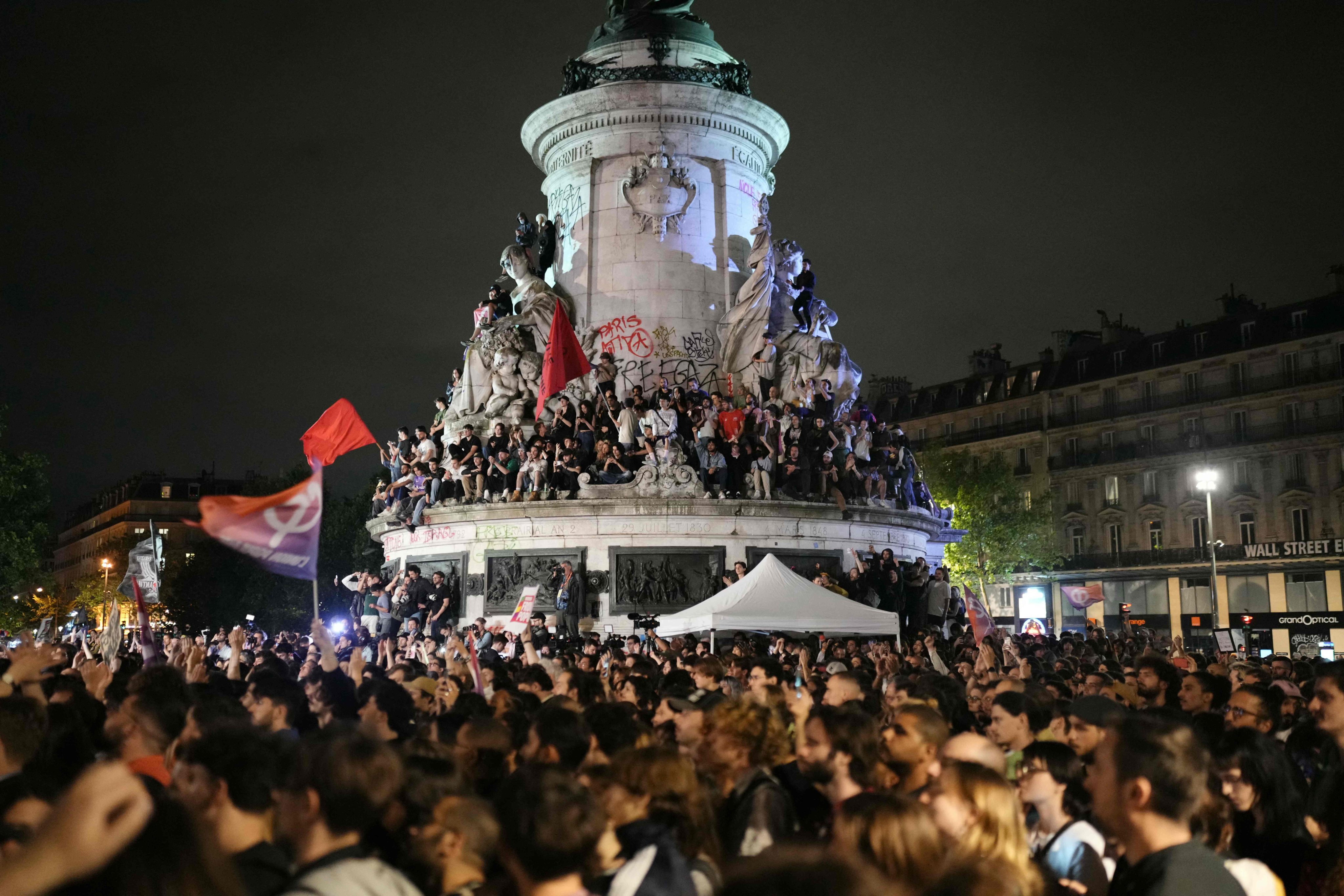 Demonstrators rally against the far-right after France announced first-round election results, at Place de la Republique in Paris on June 30. The election has left France politically divided. Photo: AFP