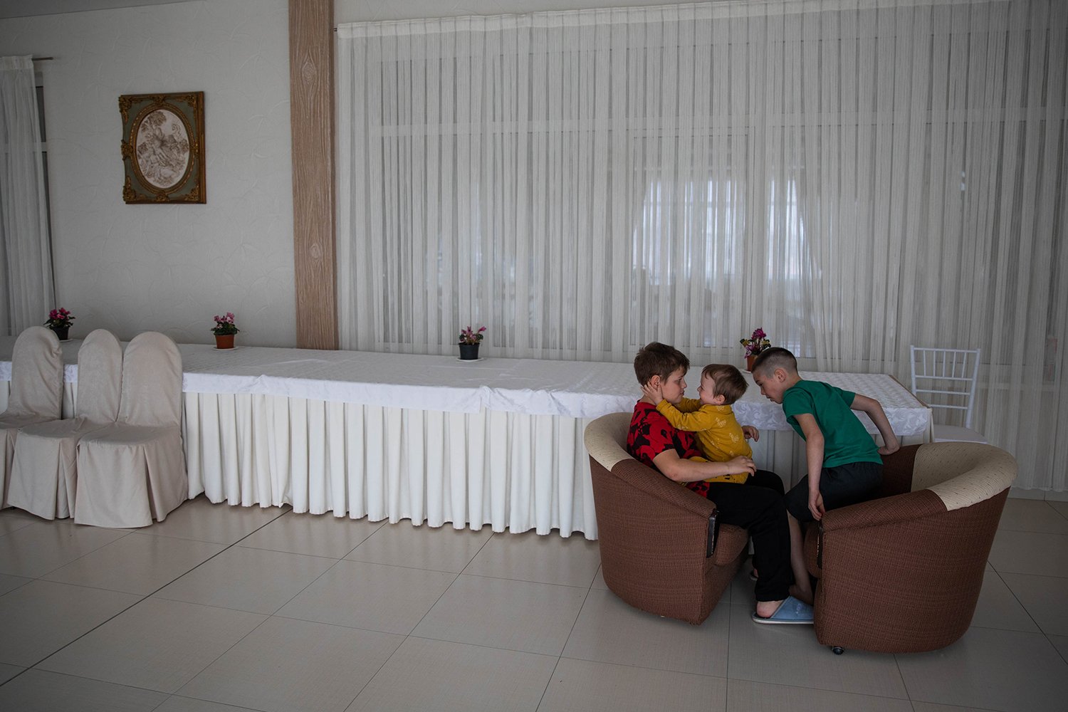 Children play inside a lobby of La Costesti.
