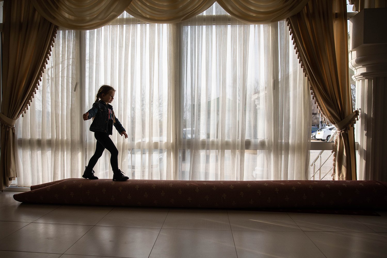 A child plays inside a lobby of La Costesti.