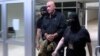 Former Montenegrin special prosecutor Milivoje Katnic is taken into custody.