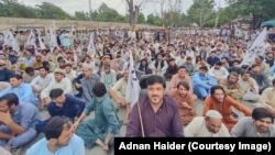 Residents of Pakistan's Khyber Pakhtunkhwa Province protest against a lack of security in the region in a June 15 demonstration that condemned both the government and extremists.