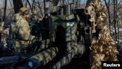 A soldier of the 12th Special Forces Brigade Azov of the National Guard of Ukraine prepares to fire at an undisclosed location in the Donetsk region, Ukraine. (file photo)