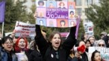 Women with placards that read, "Raise your son" and "We need rights 365 days a year" participated in a rally in celebration of International Women's Day in Bishkek, Kyrgyzstan, on March 8. The theme for this year's event was: Invest In Women: Accelerate Progress.