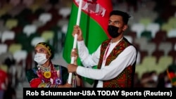 Afghan athletes, seen here at the last Olympics in Tokyo, will be competing under the same flag despite the Taliban's seizure of power. 