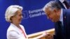 European Commission President Ursula von der Leyen (left) is greeted by Hungarian Prime Minister Viktor Orban during a meeting at the EU summit in Brussels on June 17.