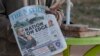 A newspaper vendor holds The Nation newspaper with a cover picture of the missing plane Vice State President Saulos Klaus Chilima in Lilongwe, Malawi, on June 11, 2024. 