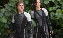 Actors Josh Hutcherson (L) and Jennifer Lawrence (R)on the set of the film "The Hunger Games: Catching Fire"