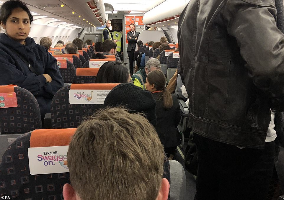The scene inside an easyJet plane today, three hours after it landed at Manchester having been diverted from Gatwick Airport which was closed because of the sighting of drones