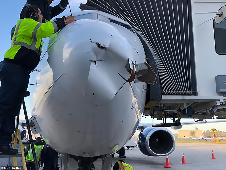 Mechanics were forced to remove seconds of the aircraft's nose cone which was damaged shortly before landing 