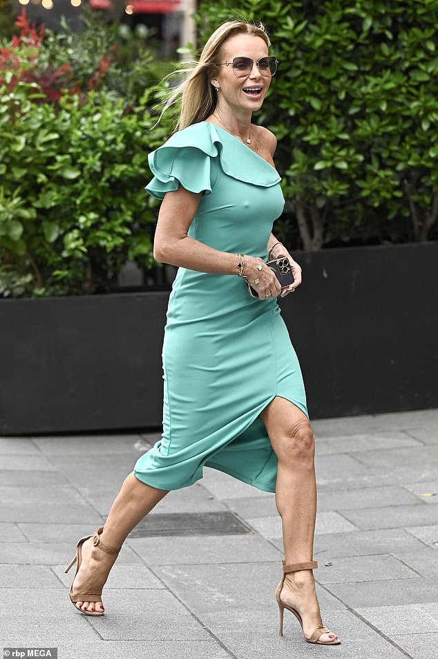 The TV and radio host, 53, made sure all eyes were on her as she showcased her incredible figure in a one-shoulder bow midi dress, which is part of her summer collaboration with Lipsy