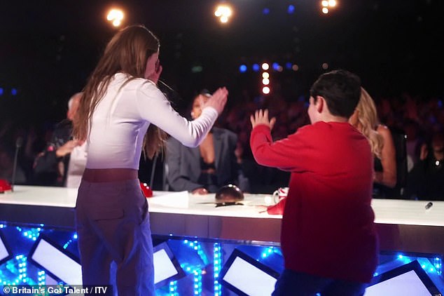 Simon said he had 'never heard a reaction like that before' before gesturing to his son Eric, 10, to push the button after Japanese skipping dancers Haribow auditioned