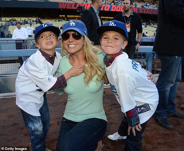 'She wanted to keep this quiet because she didn't want it to jeopardize their chances of reconciliation,' the source said. Britney and her boys pictured in 2013
