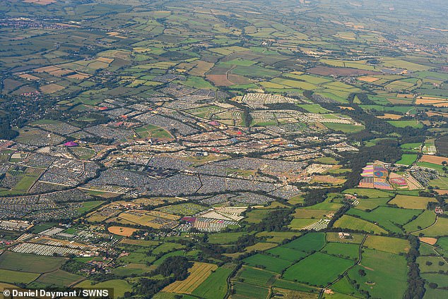 An aerial views capture the sheer scale of the Glastonbury Festival as people settle in on the first evening