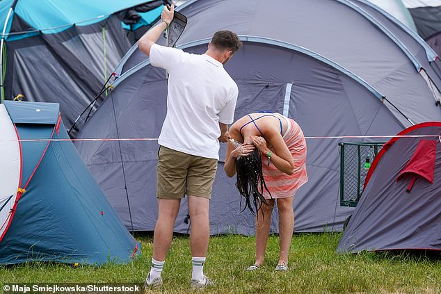 Some revellers opted to have a wash outside their tent instead of braving the shower queues