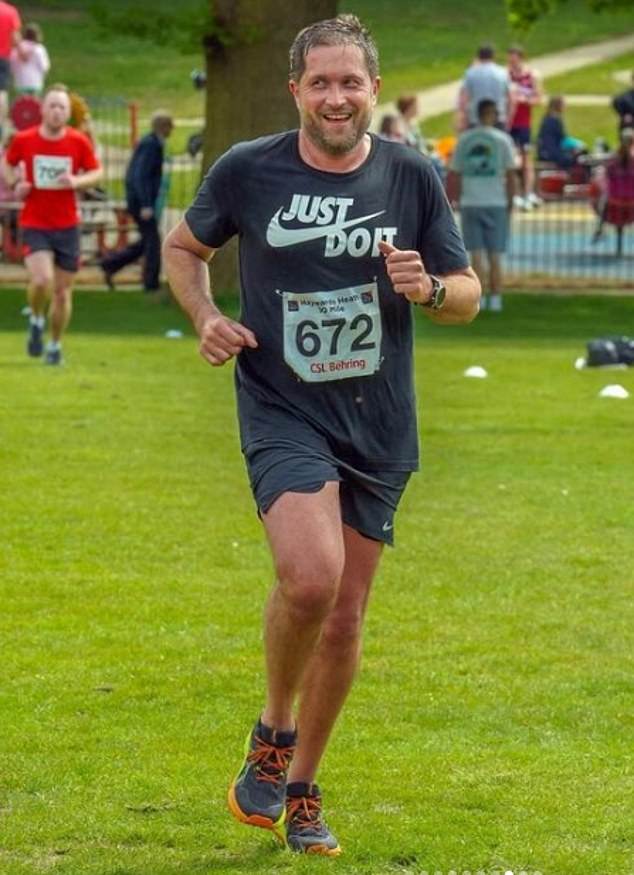 Keen runner Mark, 45, is pictured here on social media taking part in the Mid Sussex marathon