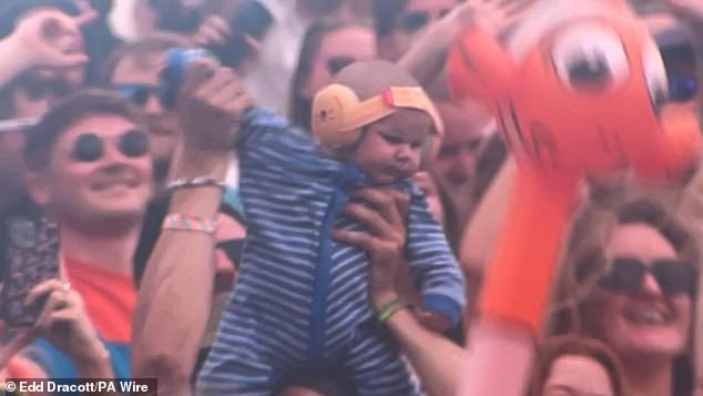 Adorable baby Finlay was met with cheers as he appeared on the big screen multiple times while Irish DJ Mac opened Worthy Farm's second biggest stage