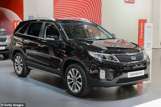 Pictured: A 2014 Kia Sorento - the same one the TikToker was driving - stands on display at the 2014 Brussels motor show.