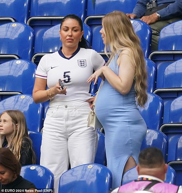 Olivia Naylor, the girlfriend of defender John Stones, chatted to another spectator ahead of the game