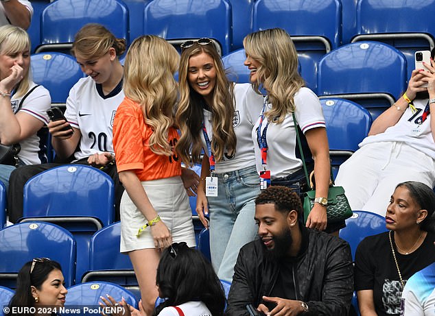 The three women dhared a joke as they chatted ahead of the Three Lions' crucial clash