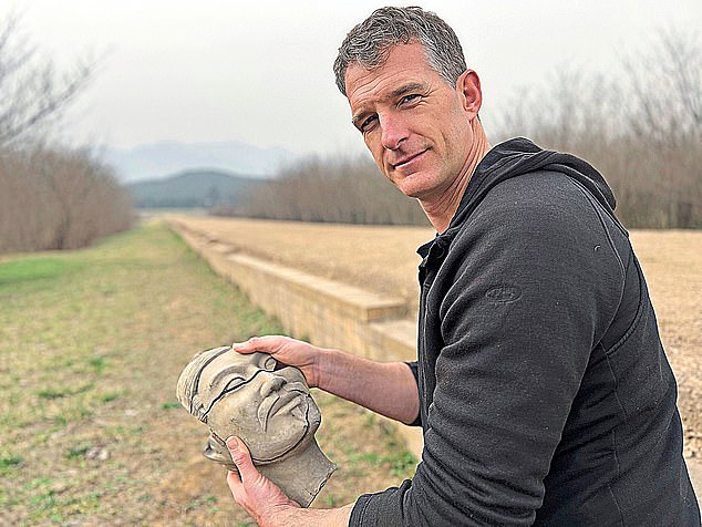 Snow, pictured holding a fake reconstructed Terracotta head during the documentary series