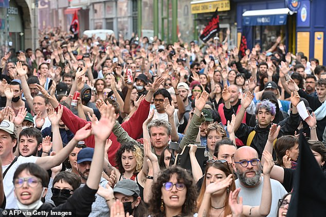 Demonstrators gesture as they take part in a rally after the announcement of the results of the first round of parliamentary elections in Nantes