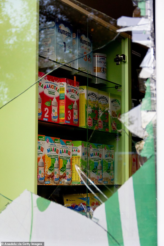 Glass in a shop window is smashed following the strikes in the city