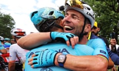 Mark Cavendish celebrates with Alexey Lutsenko after his record-breaking win
