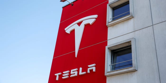 FILE PHOTO: The logo of Tesla is seen at a branch office in Bern, Switzerland March 25, 2020. REUTERS/Arnd Wiegmann