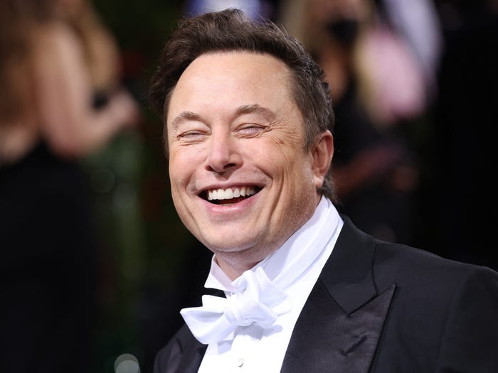 Elon Musk smiles outside the Met Gala.
