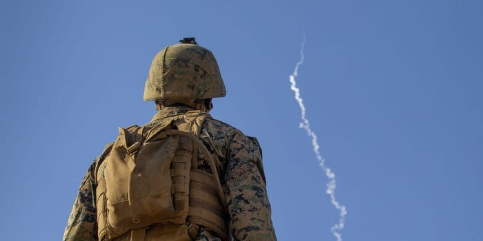 U.S. Marine Corps Lance Cpl. Dantrel Gandy, a Low Altitude Air Defense gunner with Alpha Battery, 2nd LAAD Platoon, Marine Medium Tilt Rotor Squadron – 363 (Reinforced), with Marine Rotational Force – Darwin, observes a High Mobility Artillery Rocket System launch during Exercise Loobye at Bradshaw Field Training Area, NT, Australia, Aug. 12, 2021.