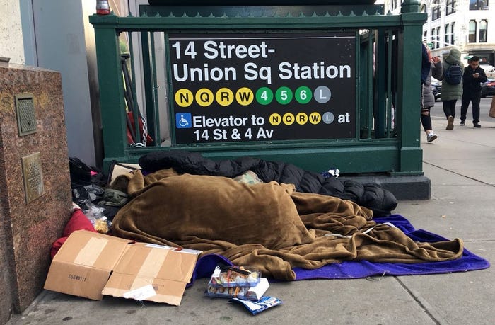 Unhoused people sleep on the streets of New York during freezing temperatures on February 16, 2018.