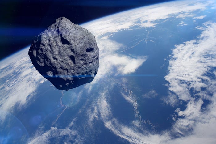 An asteroid floats above Earth