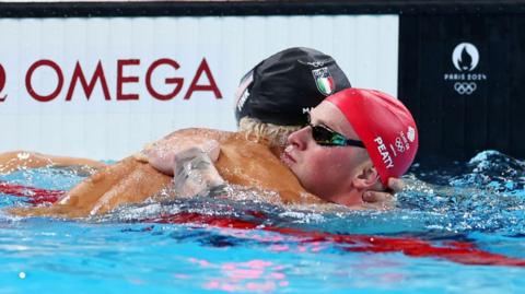 Adam Peaty at the end of his 100m race
