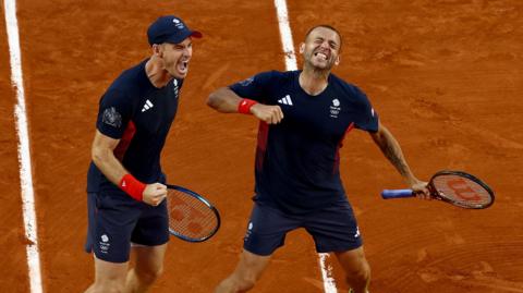 Andy Murray and Dan Evans celebrate victory