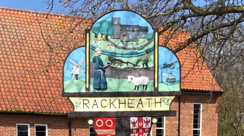 The village sign of Rackheath