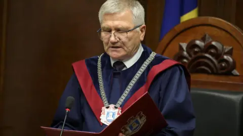 Reuters The head of Moldova's Constitutional Court reading out the ruling on Monday