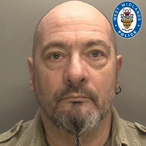 West Midlands Police A mugshot of William Clifford, he is bald, with a beard a piercing in his left eyebrow