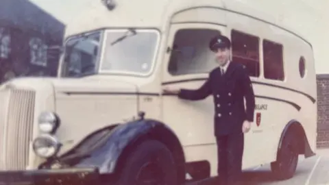 Archive image: former London ambulanceman Mark Bailey stands outside ‘Wendy’ 