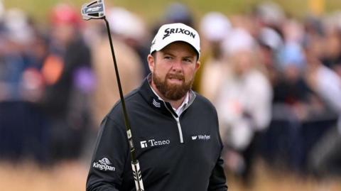 Shane Lowry acknowledges the applause of the galleries around the 18th at Royal Troon on Sunday