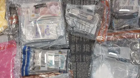 Items, including money, locked in forensic bags