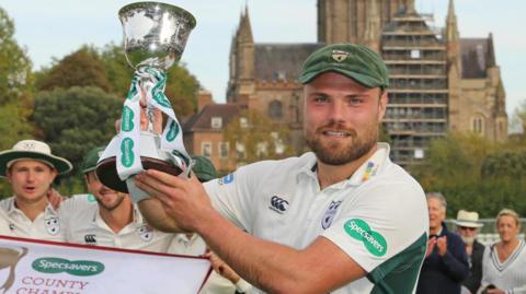 Joe Leach lifts the County Championship Division Two trophy