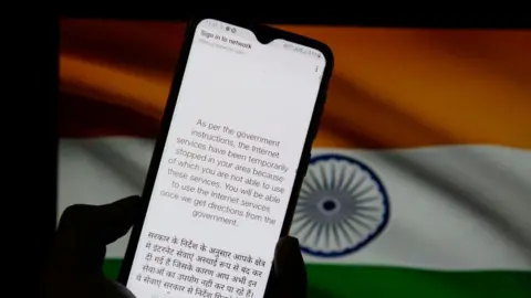 Getty Images In this photo illustration, a notification message seen displayed on a smartphone regarding internet service being suspended as per the government instructions in Kolkata.