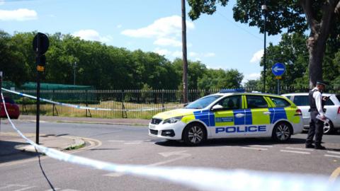 Police at Plashet Park, Newham, east London, after a man was stabbed to death