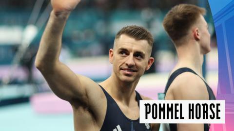 Max Whitlock with his hand up after a strong start on the pommel horse 
