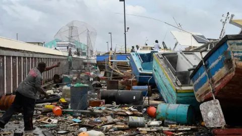 Getty Damaged fishing boats pile up after Hurricane Beryl