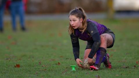 Samm Hart playing rugby