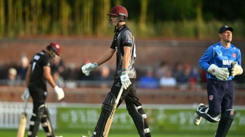 Archie Vaughan walks off after being run out without facing a ball on his Somerset debut 
