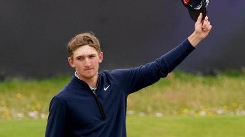 Calum Scott acknowledges the crowd on the 18th green at Royal Troon