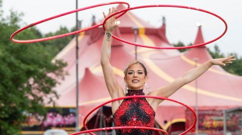 Maddie Cottnedock performing with hula hoops for the Extreme Circus  show