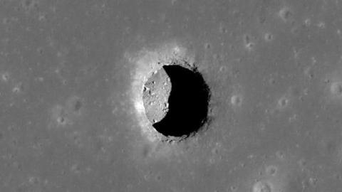 A picture of the Moon's surface with an opening called a 